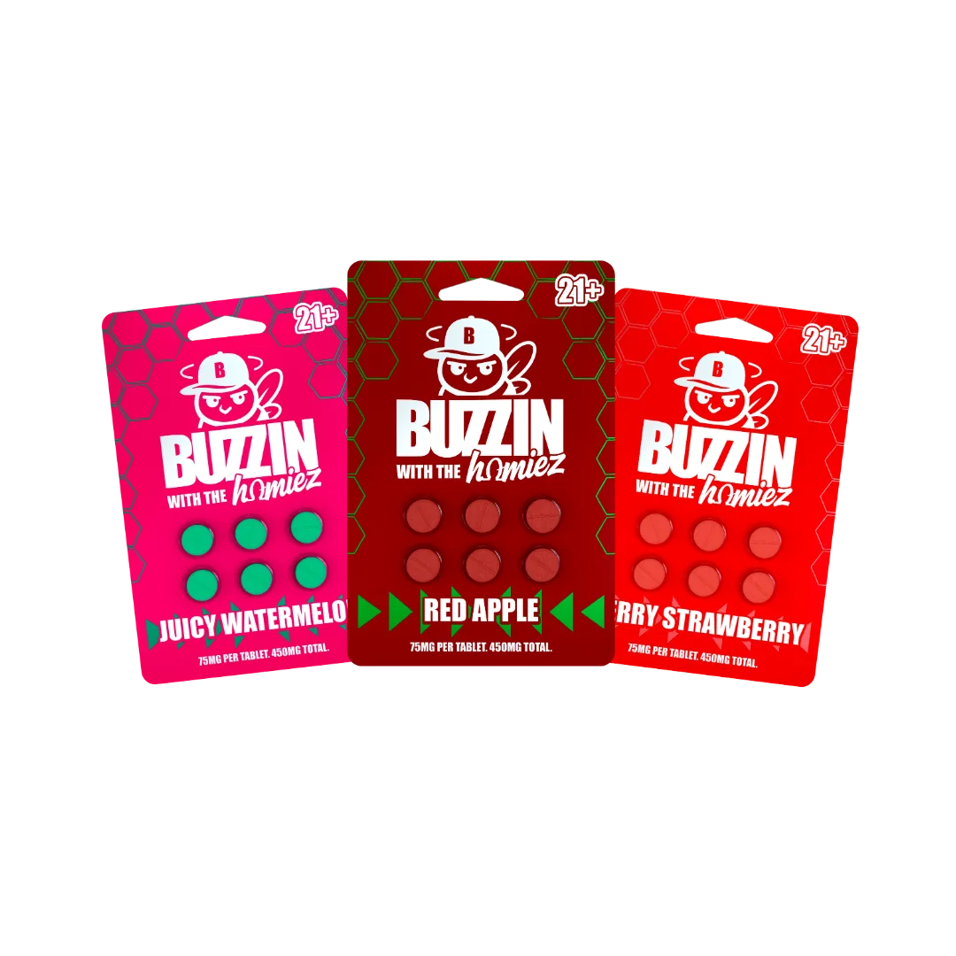 A product render of three Buzzin with the Homiez blister cards, Juicy Watermelon, Red Apple and Berry Strawberry, each marked 21+ and holding six tablets.