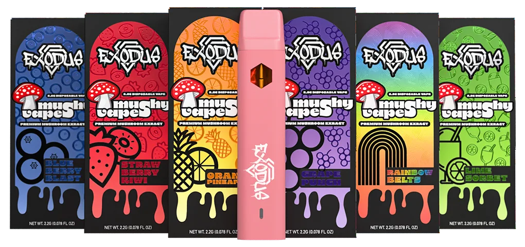 Six Exodus Mushy Vapes boxes in Blueberry Blast, Strawberry Kiwi, Orange Pineapple, Grape Punch, Rainbow Belts and Lime Sorbet, each with a red-and-white toadstool, the words Premium Mushroom Extract and 2.2G disposable vape, and a pink vape pen in the middle.