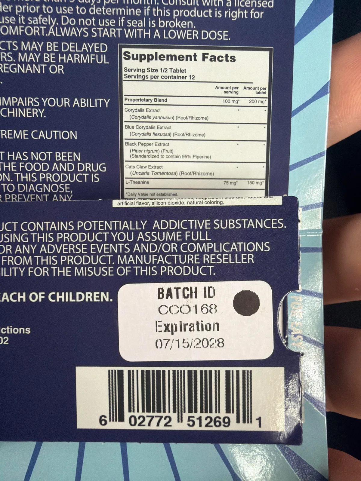 The back of a Wingz tablet card, another brand: a Supplement Facts panel with a proprietary blend of Corydalis yanhusuo, Corydalis flexuosa, black pepper extract standardized to 95 per cent piperine, cat's claw extract and L-theanine, and a white sticker reading BATCH ID CC0168, Expiration 07/15/2028.