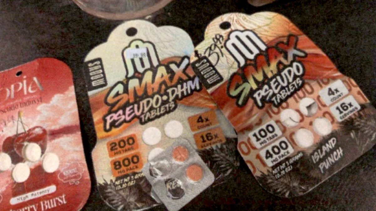 Three cards on a dark surface: an Opia pseudo indoxyl card at the left, a Modus Smax Pseudo-DHM 200 mg card with a loose blister, and a Modus Smax Pseudo Tablets 100 mg Island Punch card with a handwritten price.