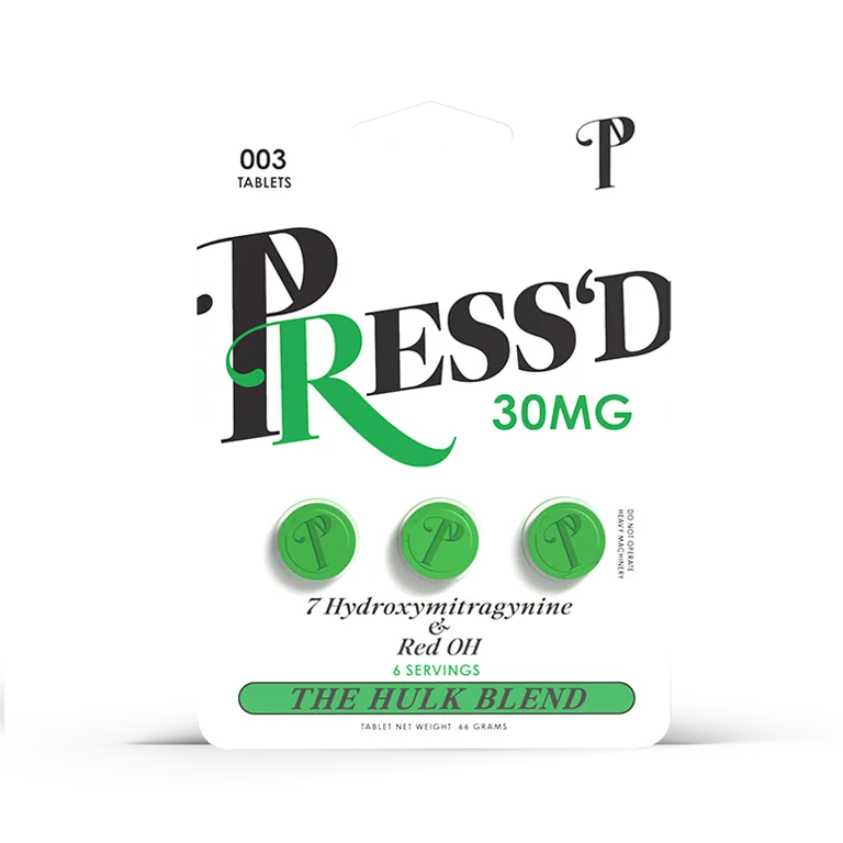 A white blister card: PRESS'D 30MG, 003 tablets, three green tablets stamped with a P, the words 7 Hydroxymitragynine & Red OH, 6 servings, THE HULK BLEND, tablet net weight .66 grams, and Do not operate heavy machinery printed sideways.