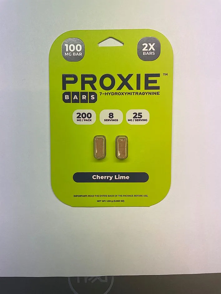 A yellow-green Proxie Bars card photographed on a white sheet: 100 MG BAR, 2X BARS, 200 mg per pack, 8 servings, 25 mg per serving, two bar tablets, Cherry Lime.