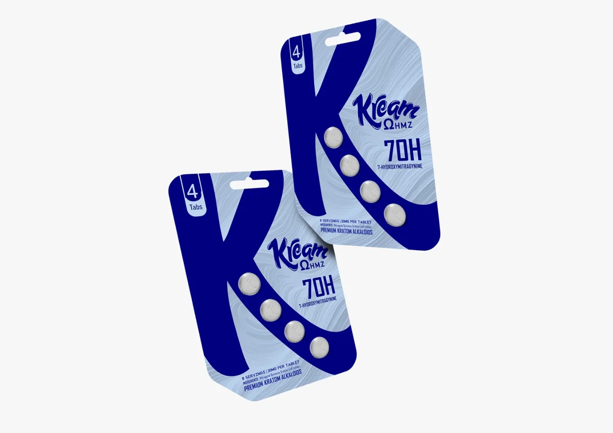 Two blue blister cards of four tablets each, printed with a large K, the word Kream in script, Ohmz, 7OH 7-Hydroxymitragynine, 8 servings, 20mg per tablet, Premium Kratom Alkaloids.